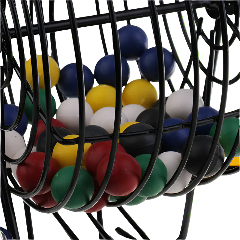 Colorful marbles in a black metal basket on a white background