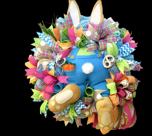 Colorful Easter wreath with bunny design on a white background