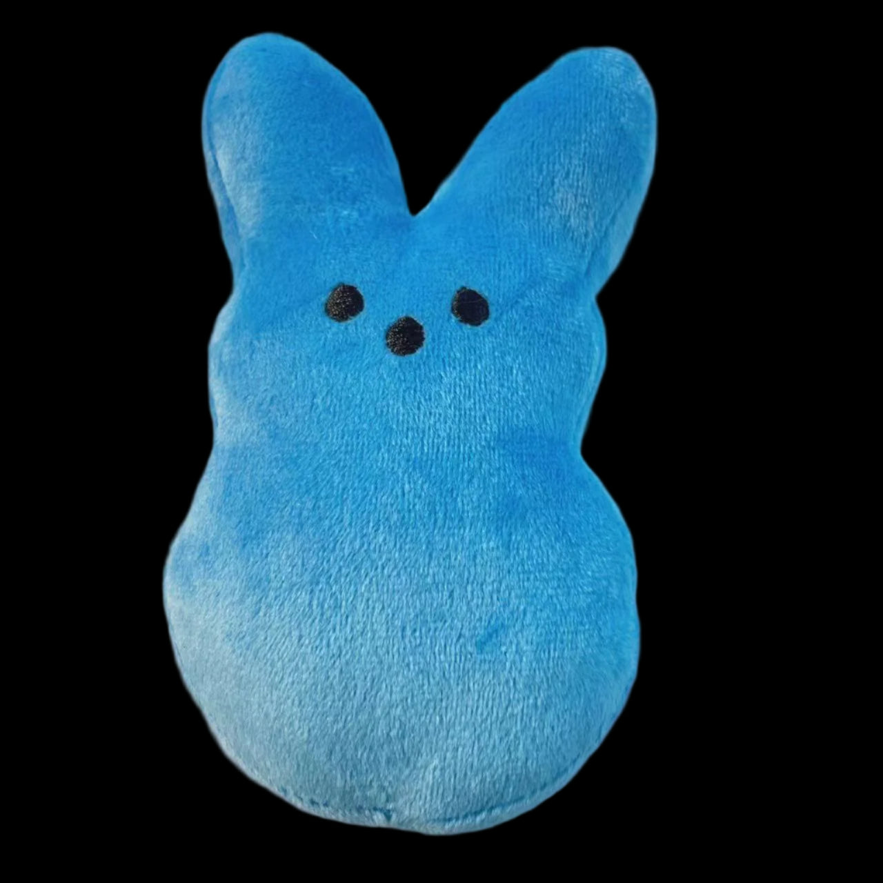 Blue plush toy with black eyes on a white background