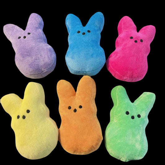 Set of six colorful plush bunnies on a white background