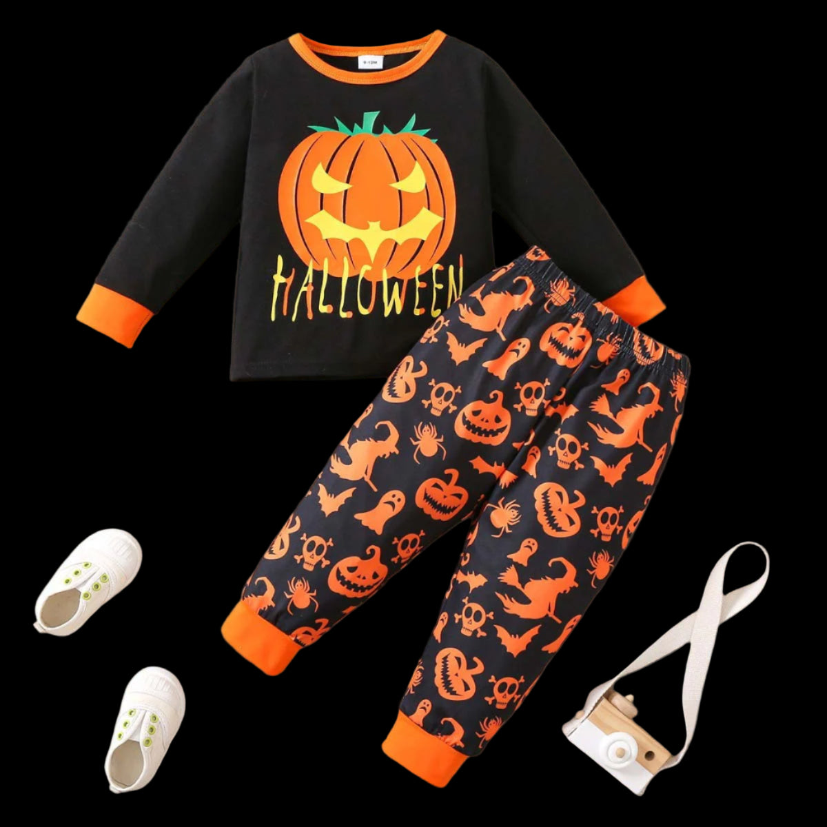 Halloween-themed children's outfit with black shirt and pants featuring pumpkins and ghosts on a dark background.
