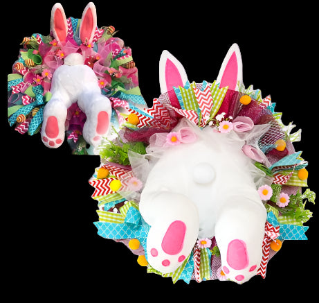 Colorful Easter wreath with bunny design on a white background