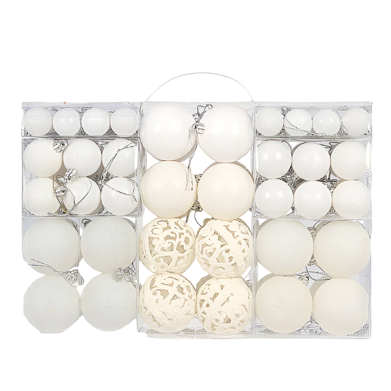Set of white Christmas ornaments in a clear box on a white background