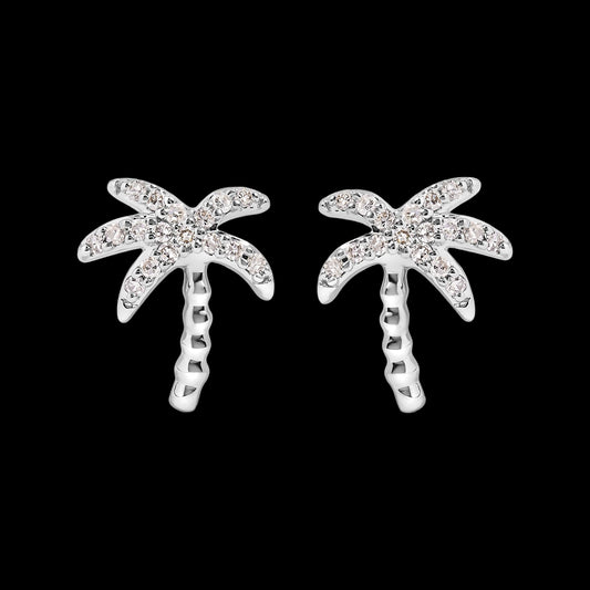 Silver palm tree earrings with clear gemstones on a white background