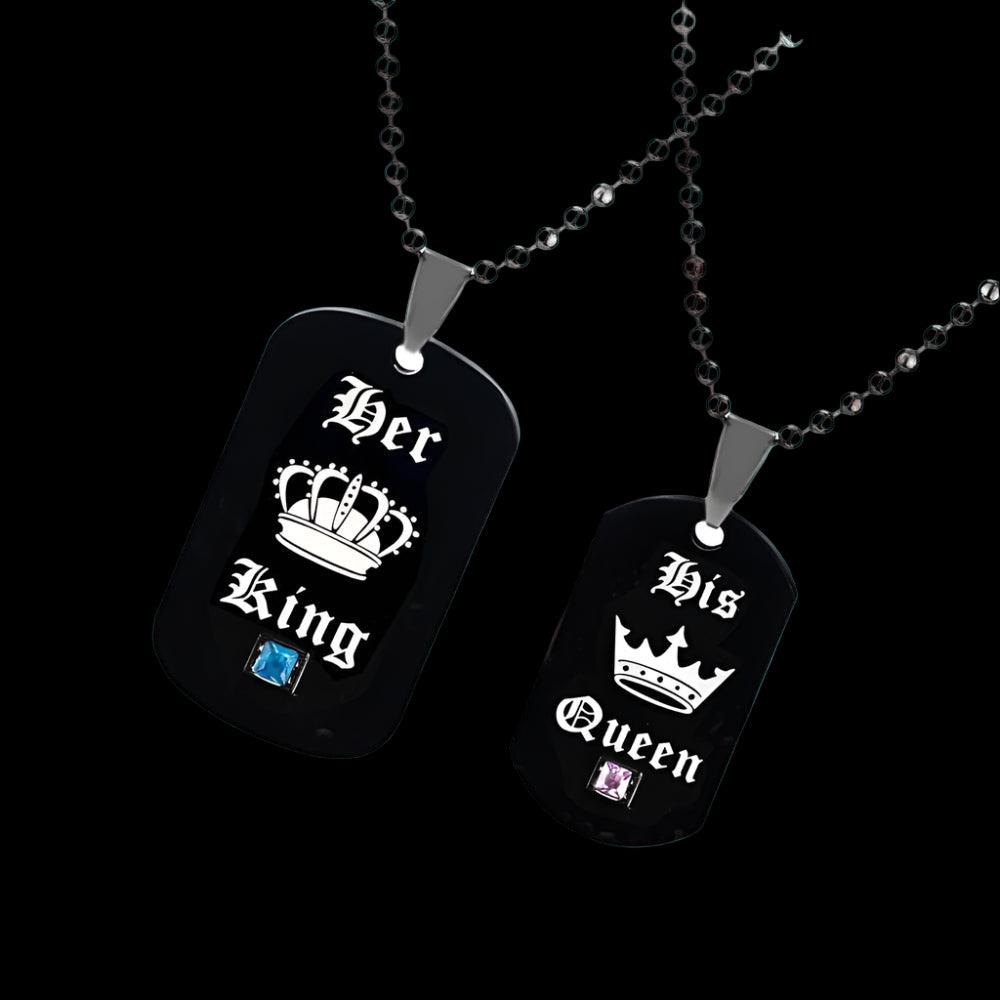 Two black dog tag necklaces with 'Her King' and 'His Queen' text on a white background.