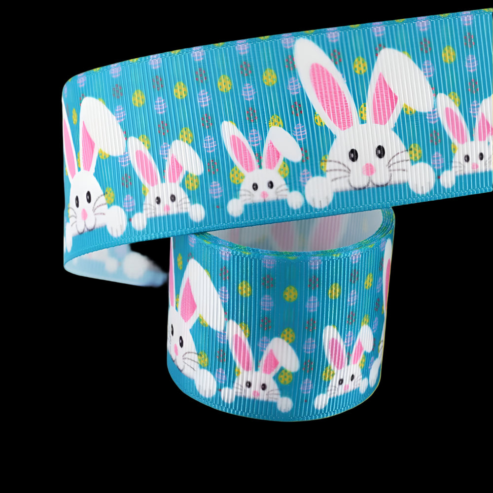 Grosgrain ribbon with Easter bunny design on a blue background