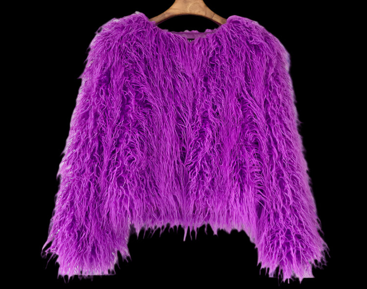Purple fluffy jacket on a wooden hanger against a light gray tiled wall.