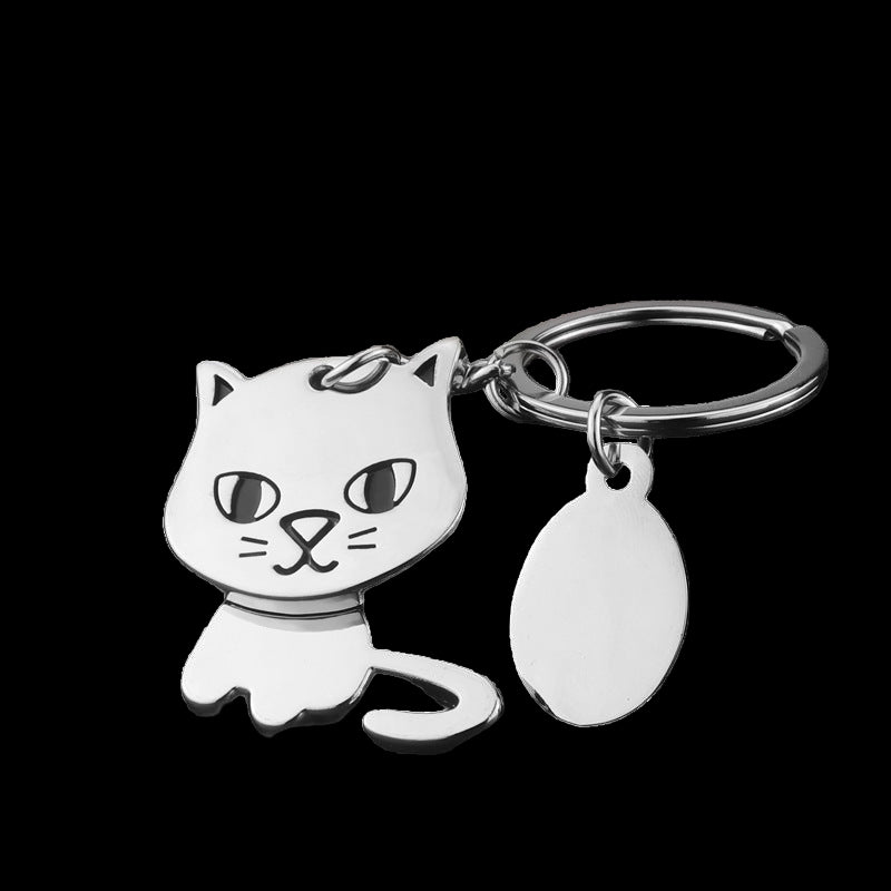 Cat-shaped keychain with a tag on a dark background