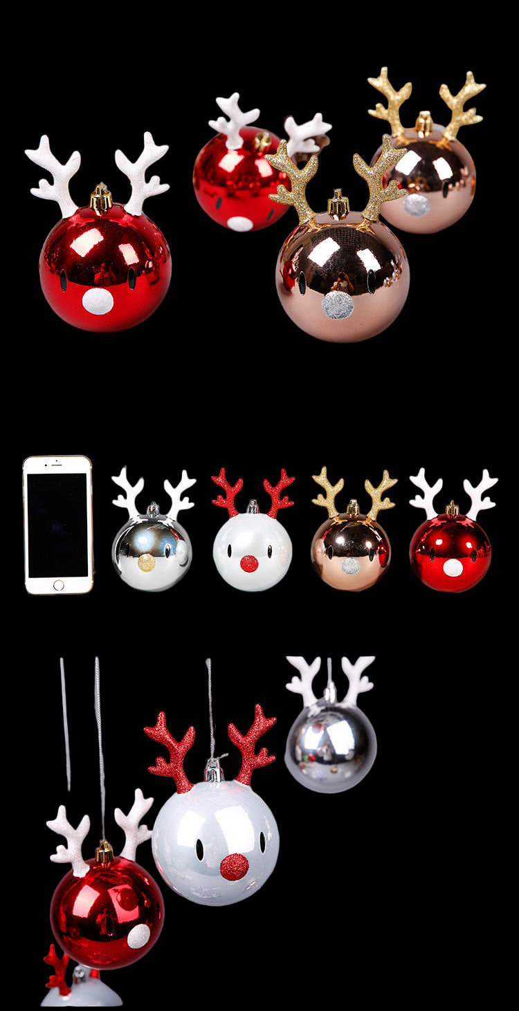 Set of Christmas-themed ball ornaments with reindeer antlers on a gray background.
