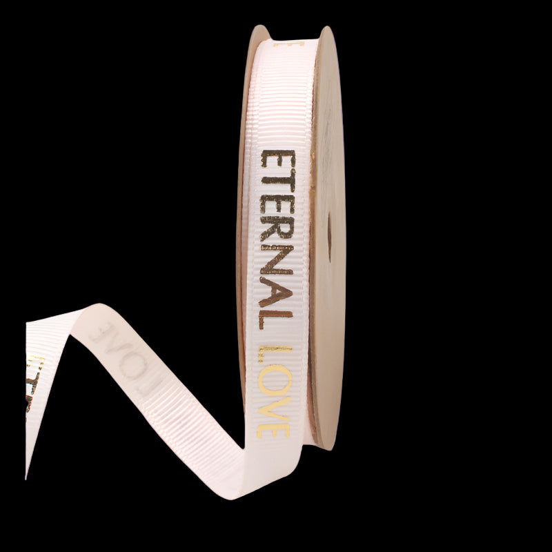 Roll of ribbon with 'Eternal Love' text on a white background
