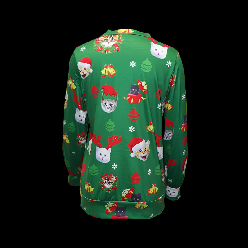 Green Christmas-themed sweater with festive designs on a white background