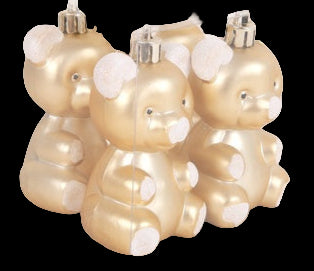Gold teddy bear-shaped ornaments in a clear packaging box on a white background