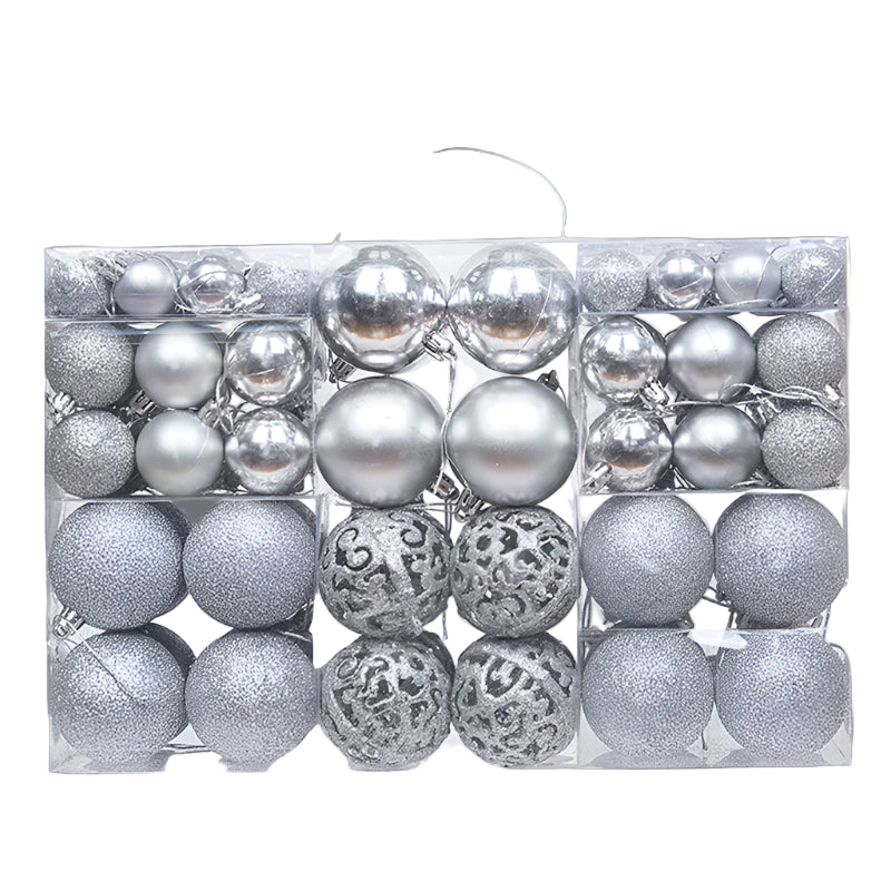 Box of silver Christmas ornaments with various textures on a white background