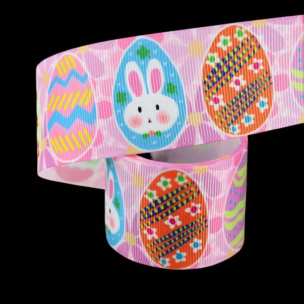 Grosgrain ribbon with Easter-themed design featuring eggs and a bunny on a pink background.