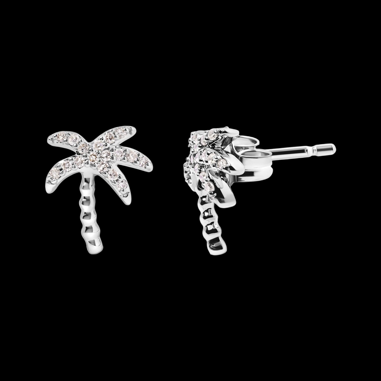 Silver palm tree earrings with clear stones on a white background