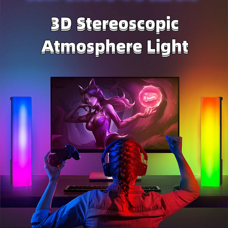 Person playing a video game with 3D stereoscopic atmosphere lights on either side of a monitor.