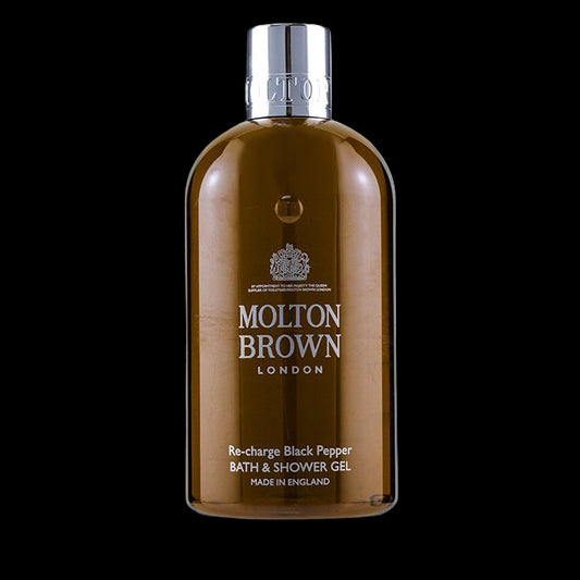 Brown bottle of Molton Brown Re-charge Black Pepper bath & shower gel on a white background