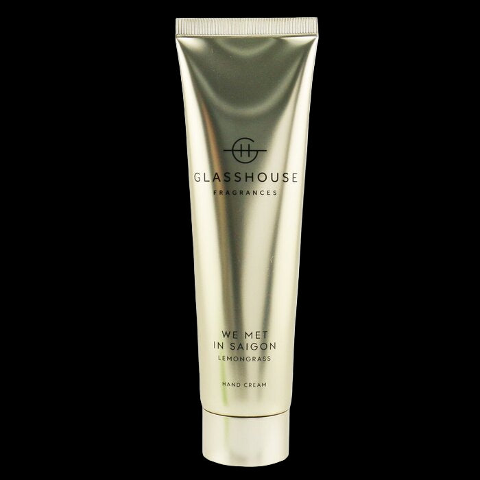 Gold tube of Glasshouse hand cream on a white background