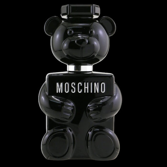 Black bear-shaped Moschino perfume bottle on a white background