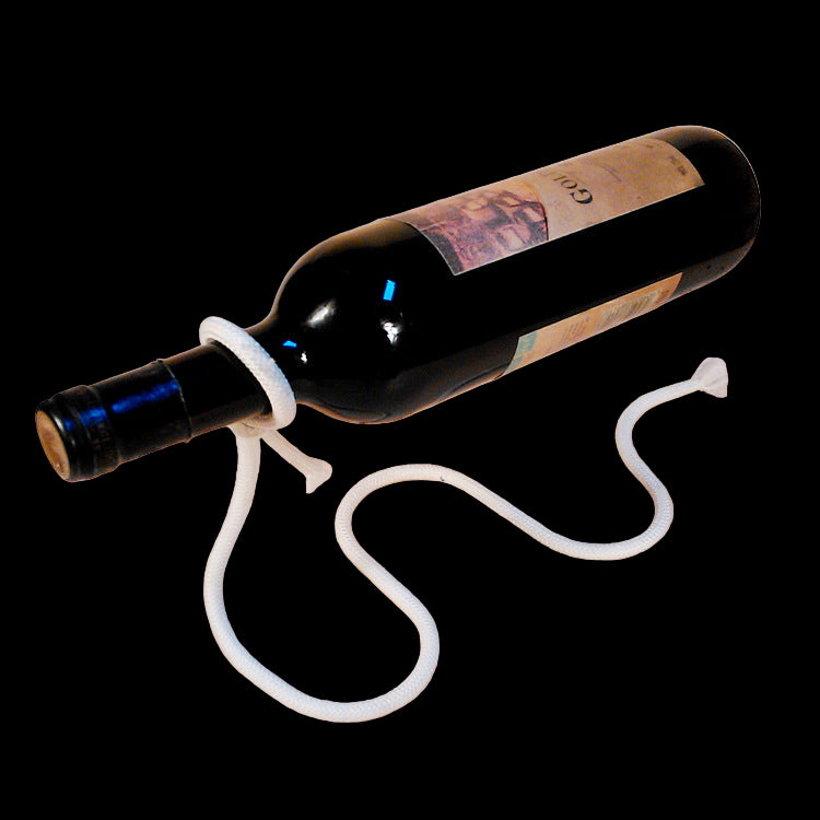 Wine bottle with a white rope on a beige background