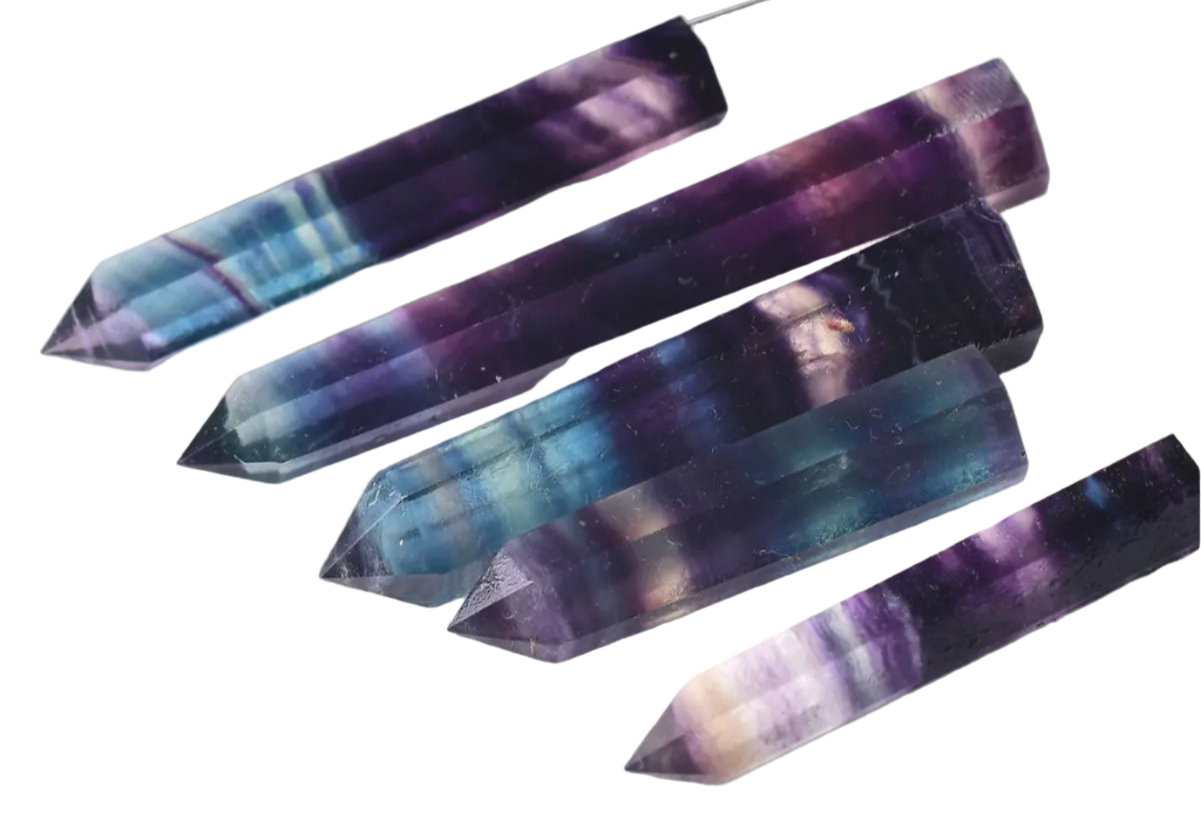 Set of multicolored crystal sticks on a white background