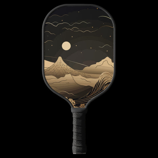 Pickleball paddle with mountain and moon design on a white background