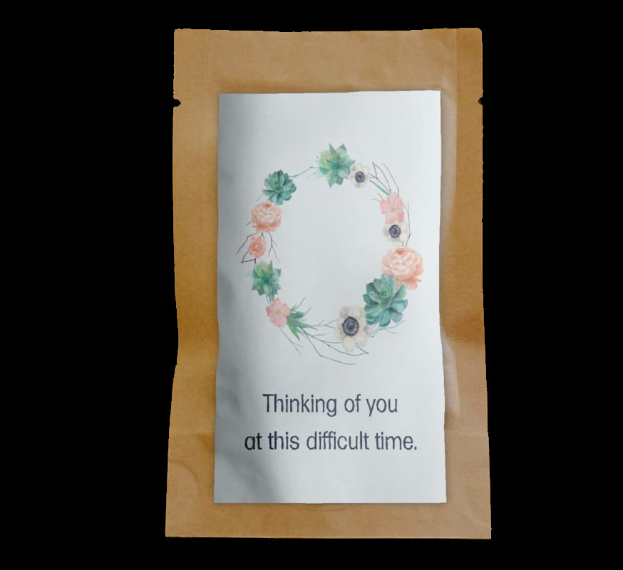 Greeting card with floral design and text on a wooden surface