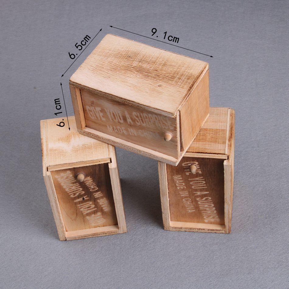 Wooden boxes with text and measurements on a gray background