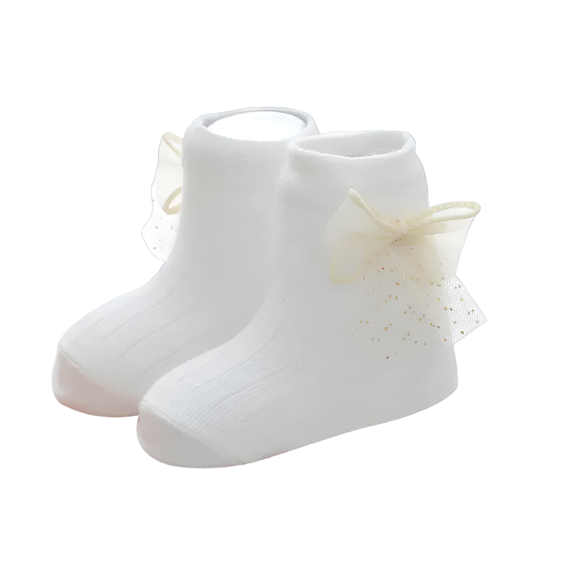 White baby socks with tulle bow on a white background