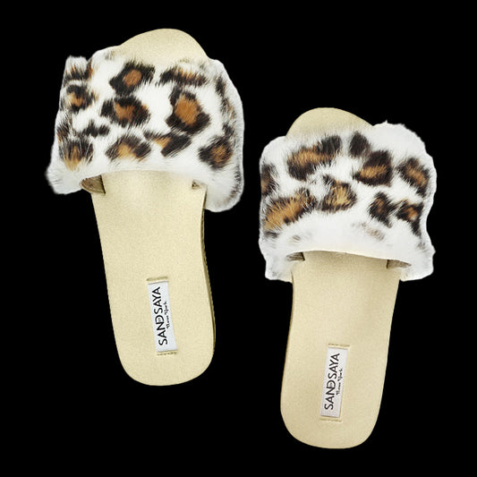 Pair of slippers with leopard print fur on a white background