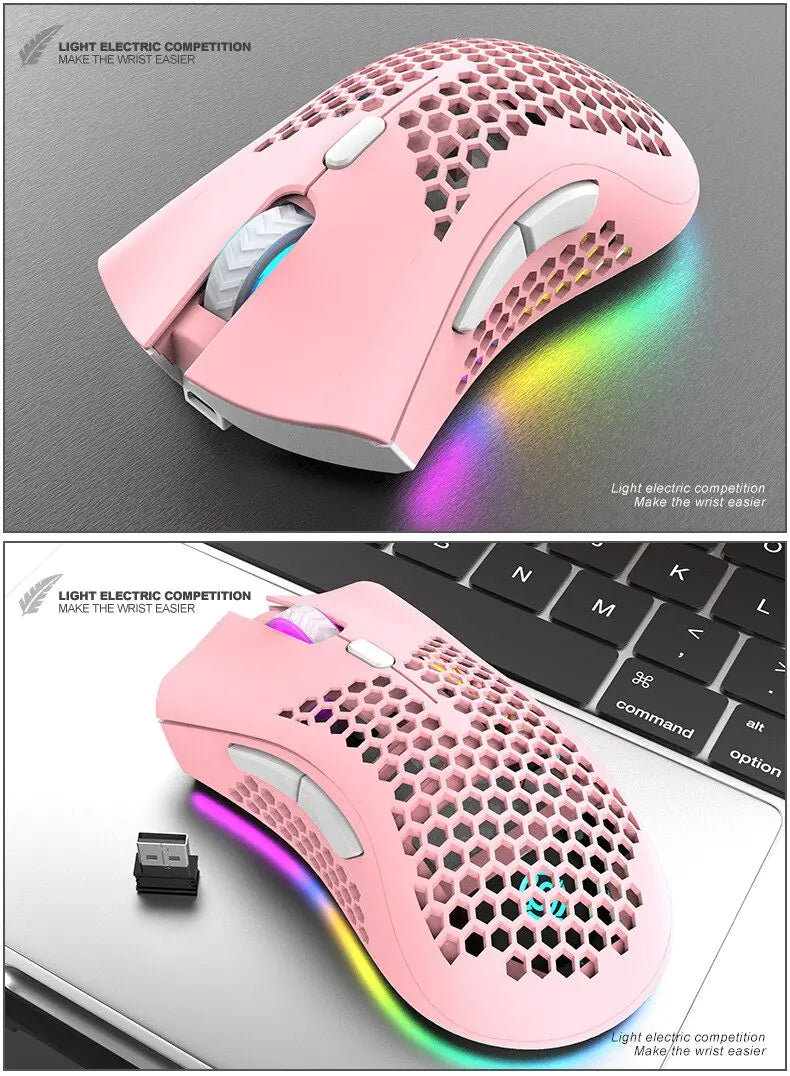 Pink wireless mouse with RGB lighting on a gray surface and keyboard background.