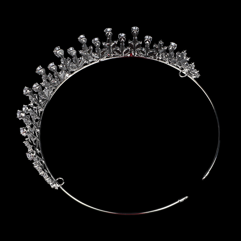 Silver tiara with clear stones on a black background