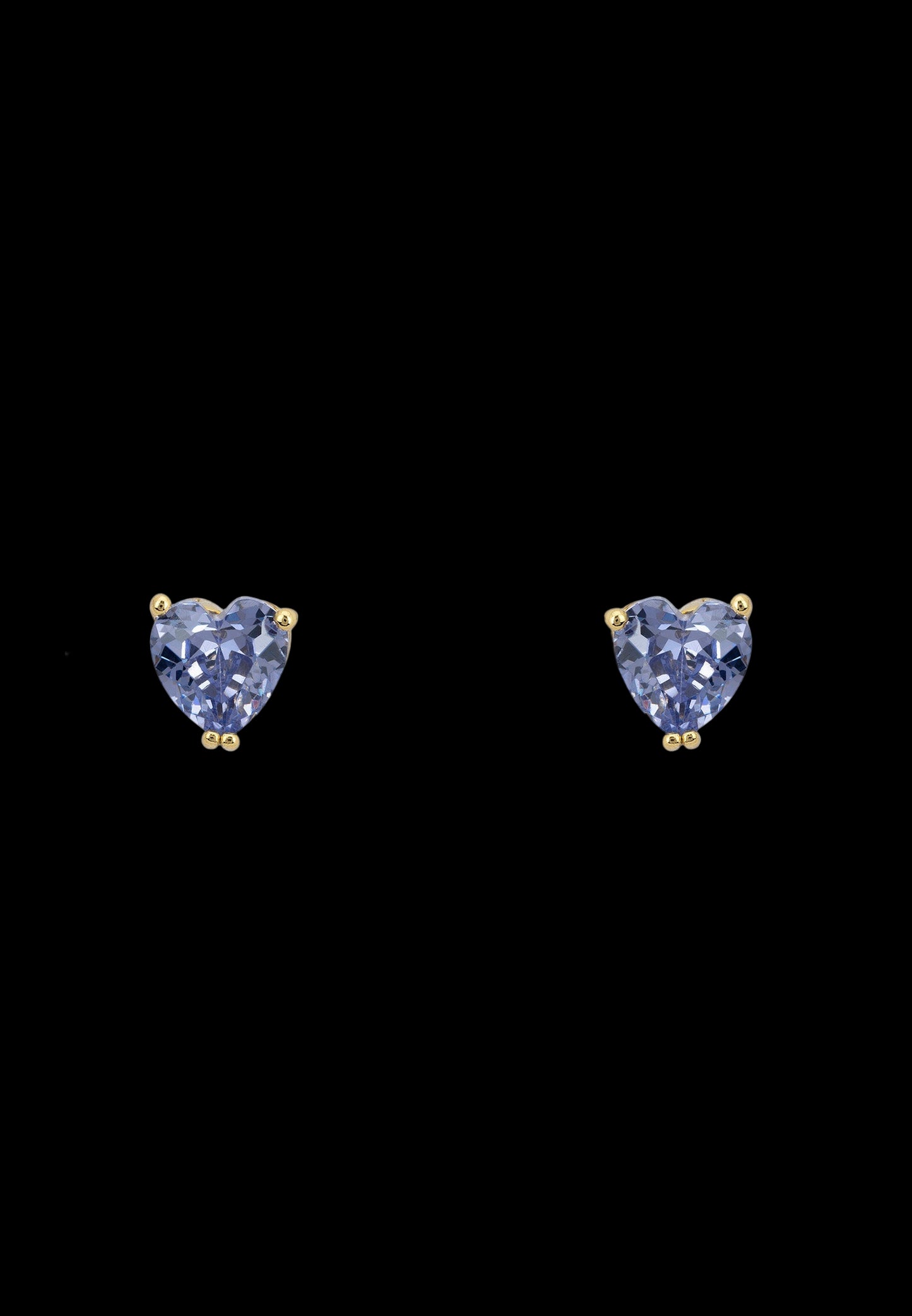 Heart-shaped blue gemstone earrings on a white background