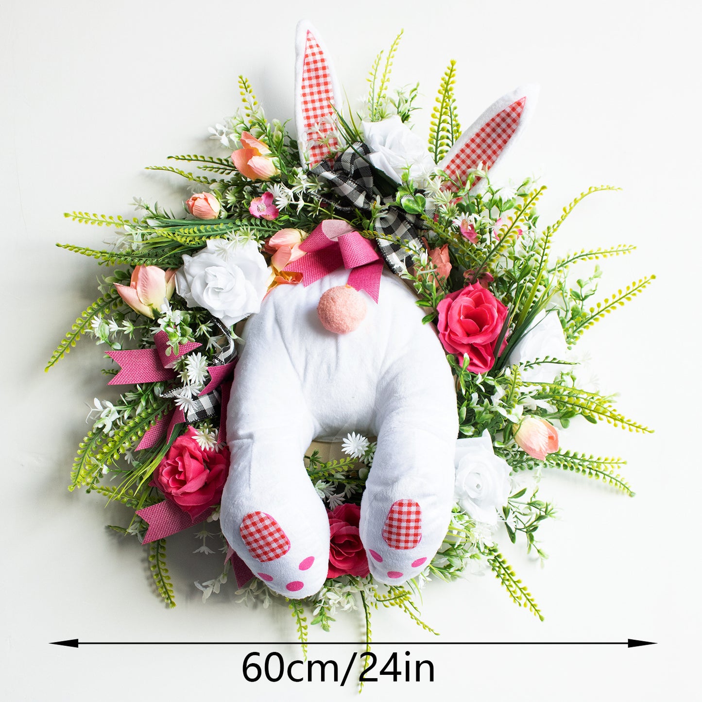 Decorative wreath with a plush bunny and flowers on a white background