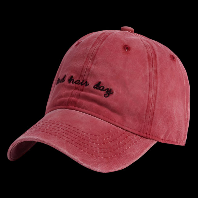 Red baseball cap with text on a white background