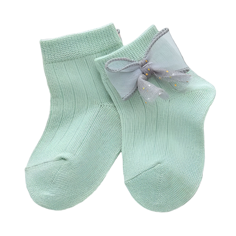 Pair of light green socks with a bow on a white background