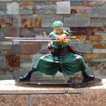 Figurine of a character in green outfit with swords against a stone wall background