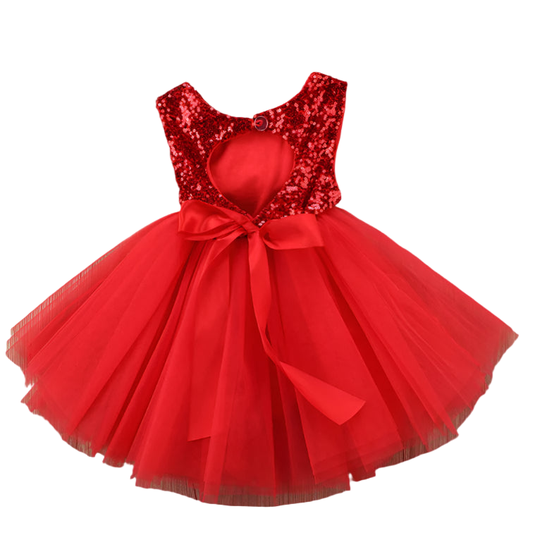 Red sequin dress with a bow on a wooden surface