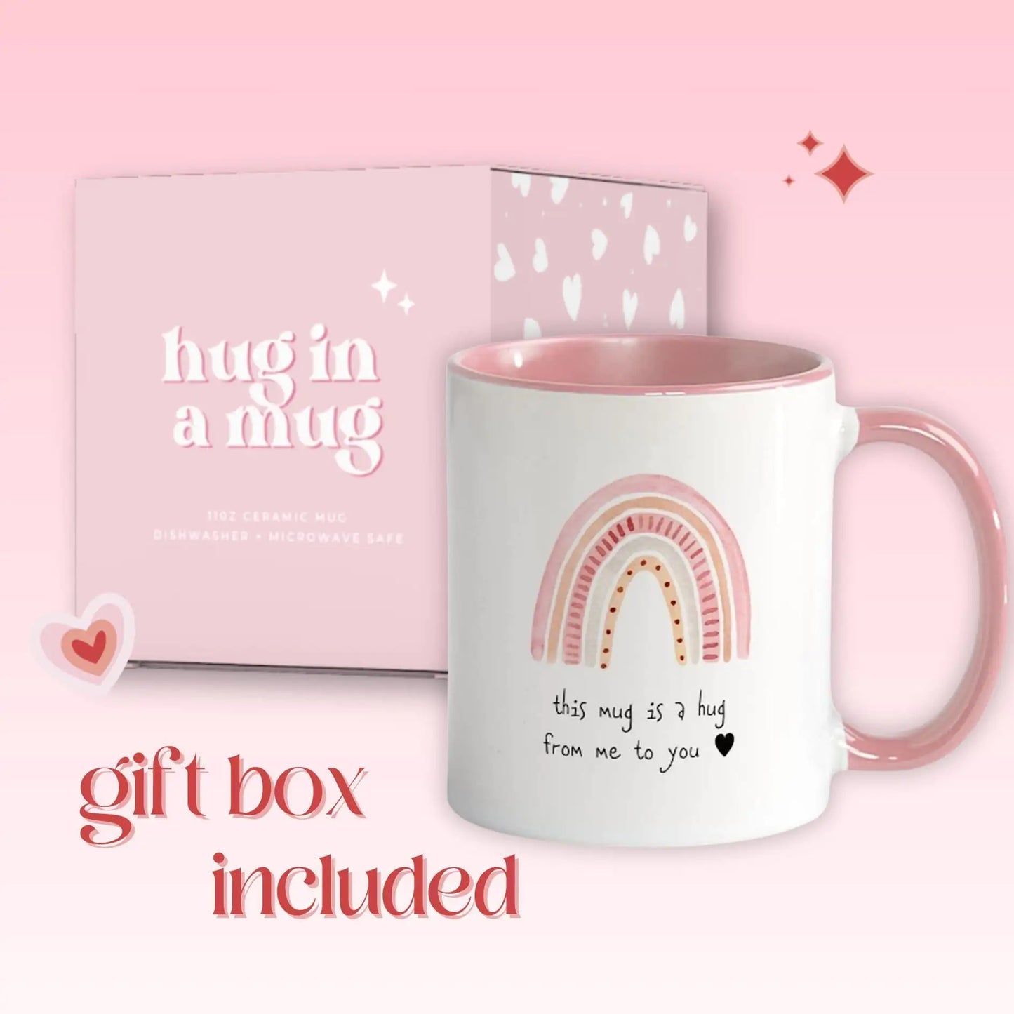 White mug with pink interior and rainbow design, accompanied by a matching gift box on a pink background.
