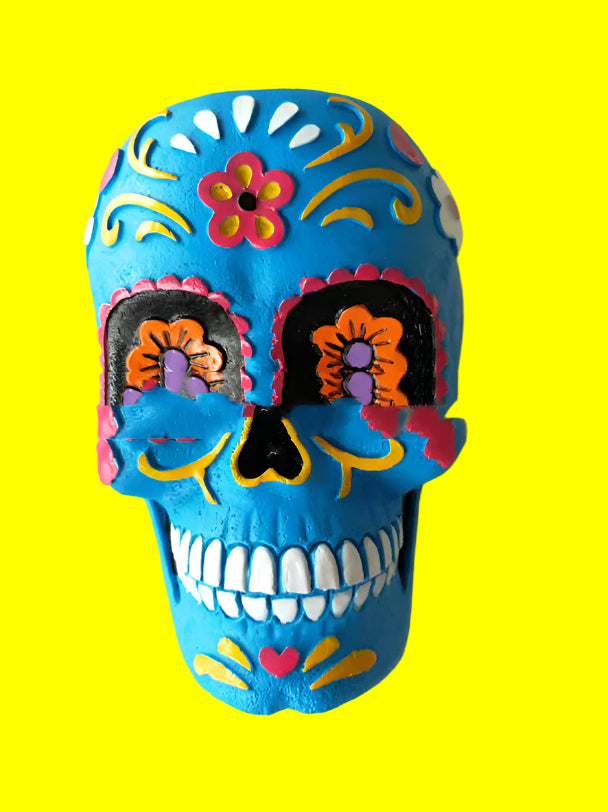 Colorful skull decoration with floral patterns on a white background