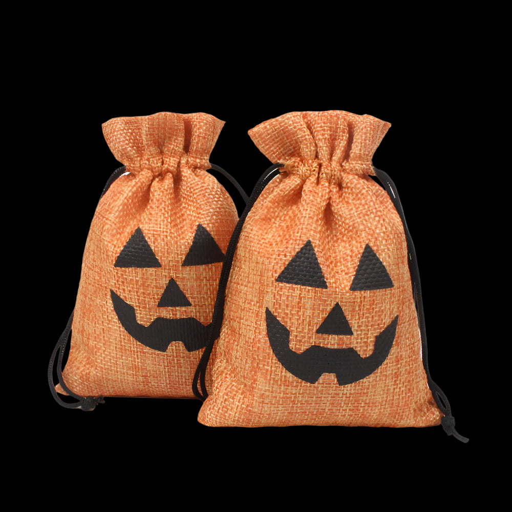 Two orange drawstring bags with black jack-o'-lantern faces on a white background