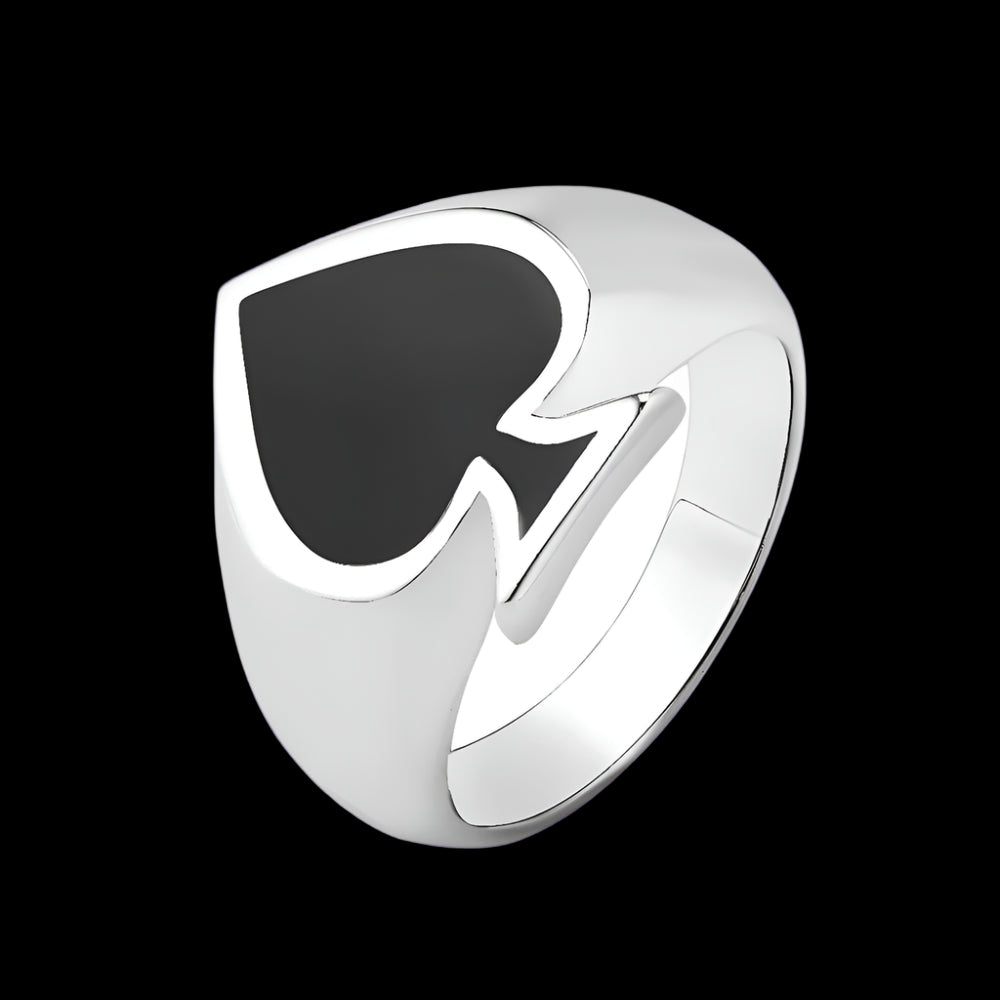 Silver ring with a black heart-shaped inset on a white background
