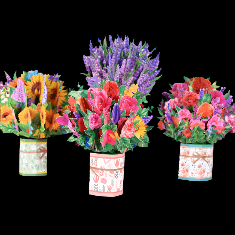 Colorful paper flower bouquets in decorative pots on a pink background