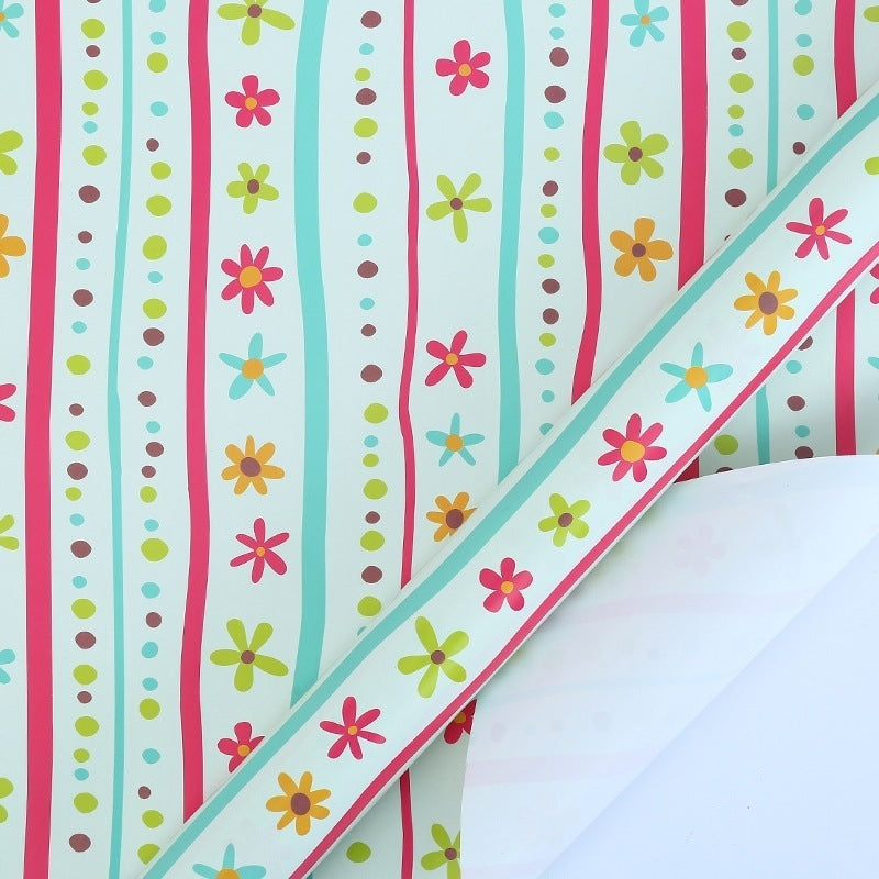 Colorful striped paper with floral patterns on a white background
