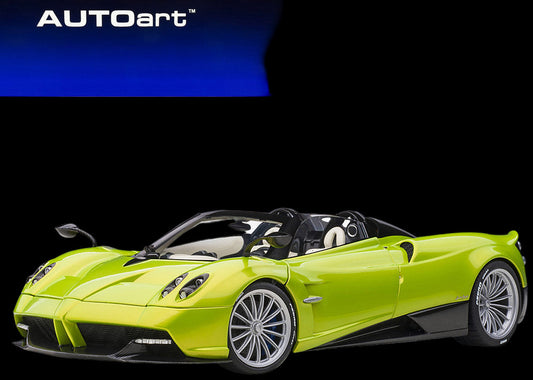Green model car in front of AUTOart packaging box