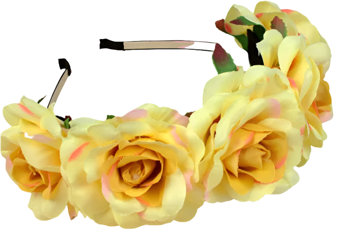Yellow flower headband on a wooden surface with a white mug in the background