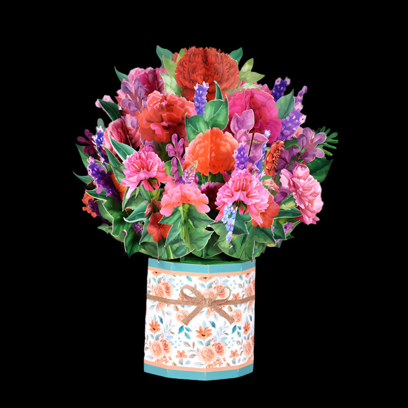 Colorful bouquet of flowers in a decorative box on a pink background