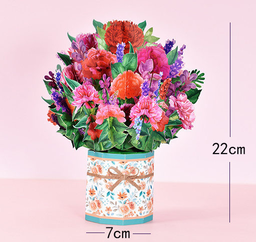 Colorful bouquet of flowers in a decorative container with measurements on a pink background
