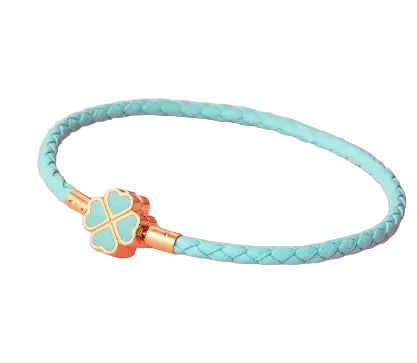 Turquoise braided bracelet with a gold clasp on a pink background