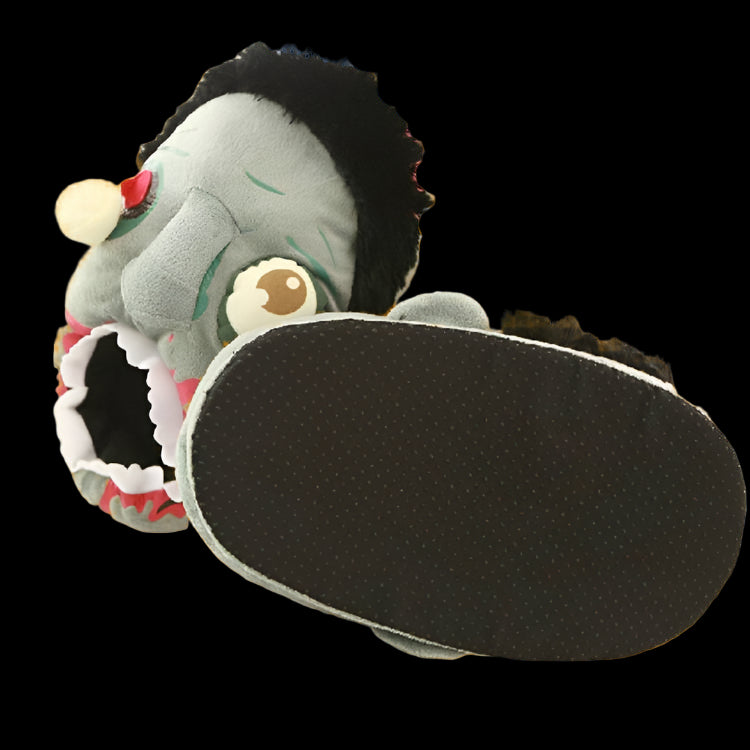 Plush toy with a black sole on a white surface with flowers in the background